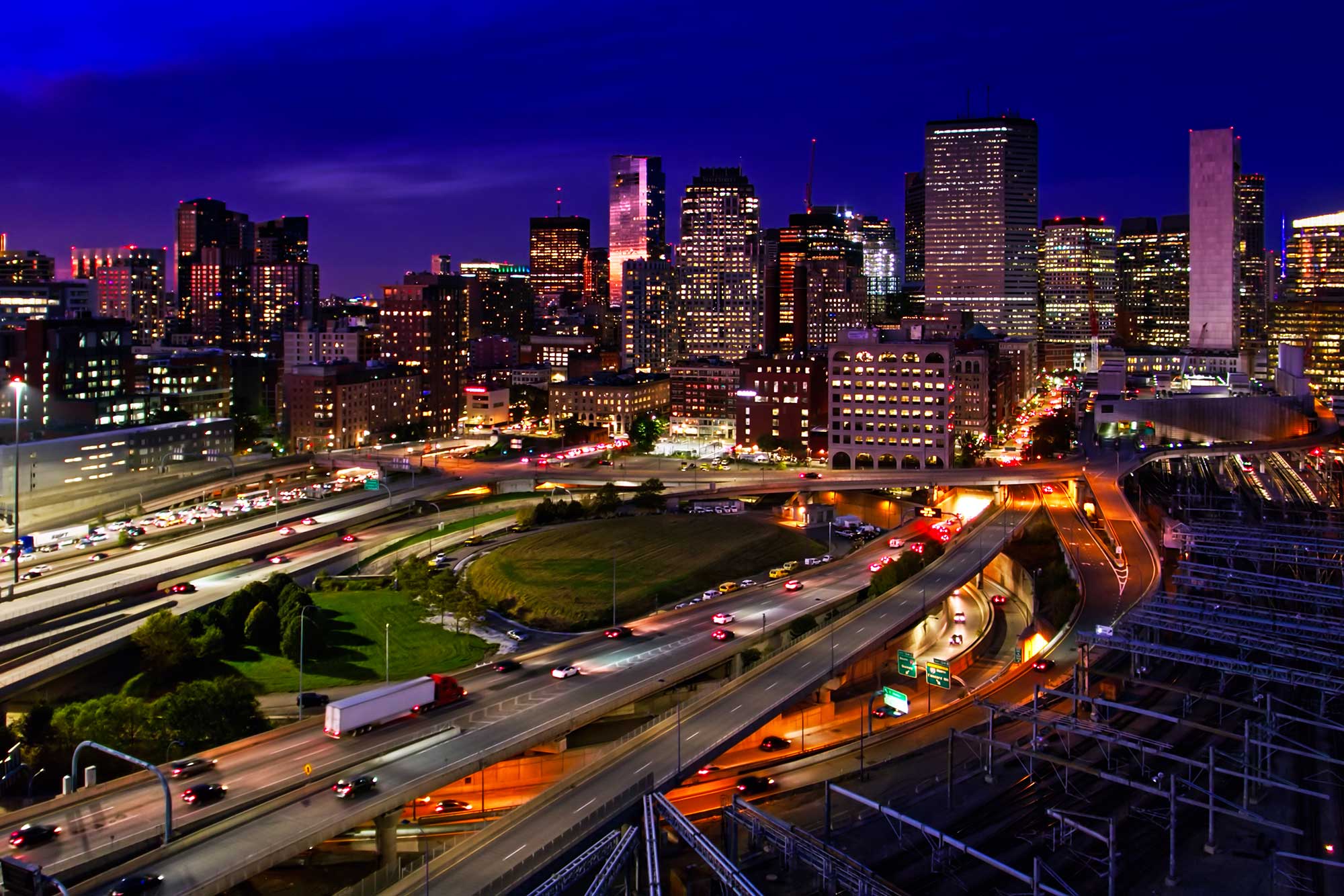 A busy highway system in Boston Massachusettes in the evening