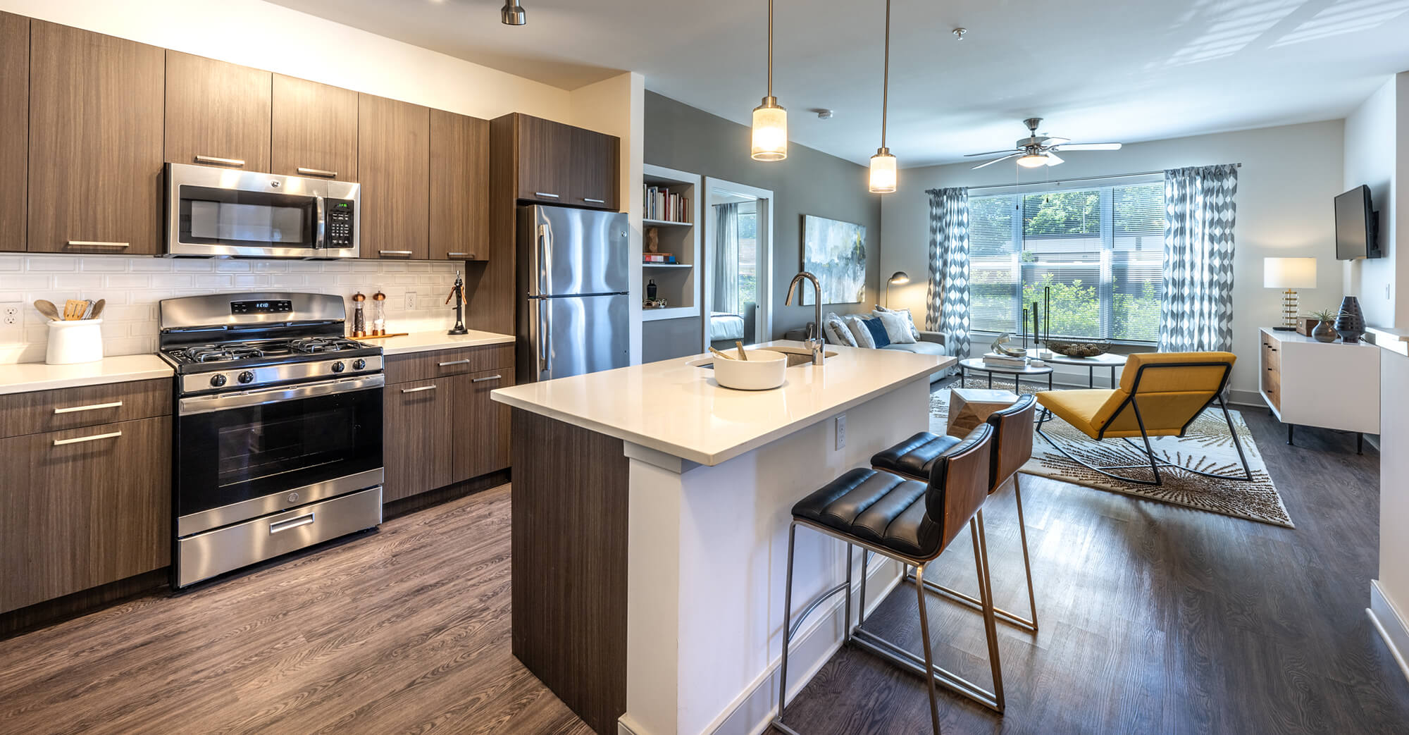 A modern open concept apartment with wood floors